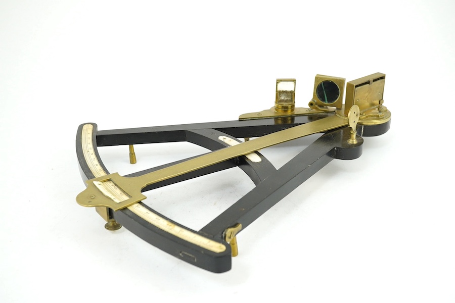 A Victorian brass mounted ebony octant with ivory scale, 36cm. Condition - poor, glass filter cracked and other minor damage overall. Ivory submission reference THSXLF51